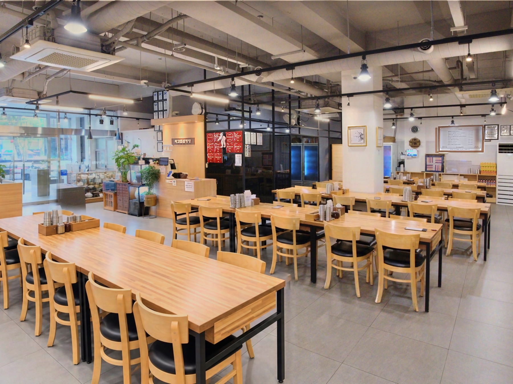 Dining hall viewed from the entrance and kitchen side